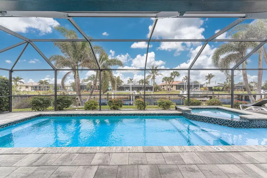 Outstanding Waterfront Home with 40' Heated Saltwater Pool: A Premier Retreat for Relaxation and Entertainment
