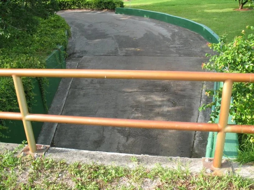 Green-lined golf cart tunnel path in Boca Raton